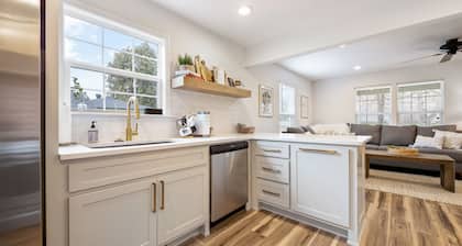 Dog-friendly home with a firepit, yard, washer/dryer, central AC & game room