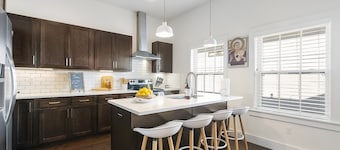 Stylish, dog-friendly condo with WiFi, board games, washer/dyer, & central AC