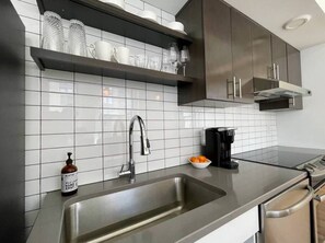 Fridge, microwave, oven, stovetop - A historic 1,200 square foot loft in the heart of the Old Market with Howard Street view (Omaha)