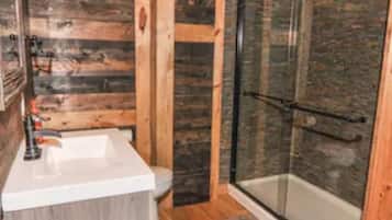 Shower, jetted bath, towels, soap