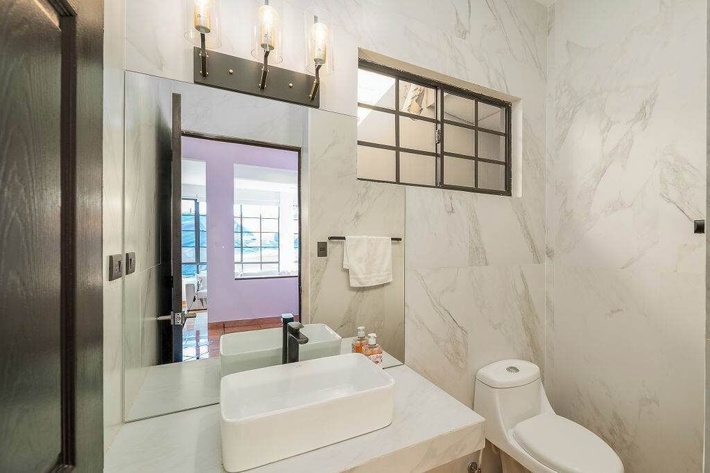 Shower, hair dryer, towels, shampoo