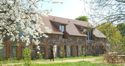 Stylishly furnished fieldstone barn with dining room and terrace by the village pond