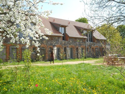 Stylishly furnished fieldstone barn with dining room and terrace by the village pond