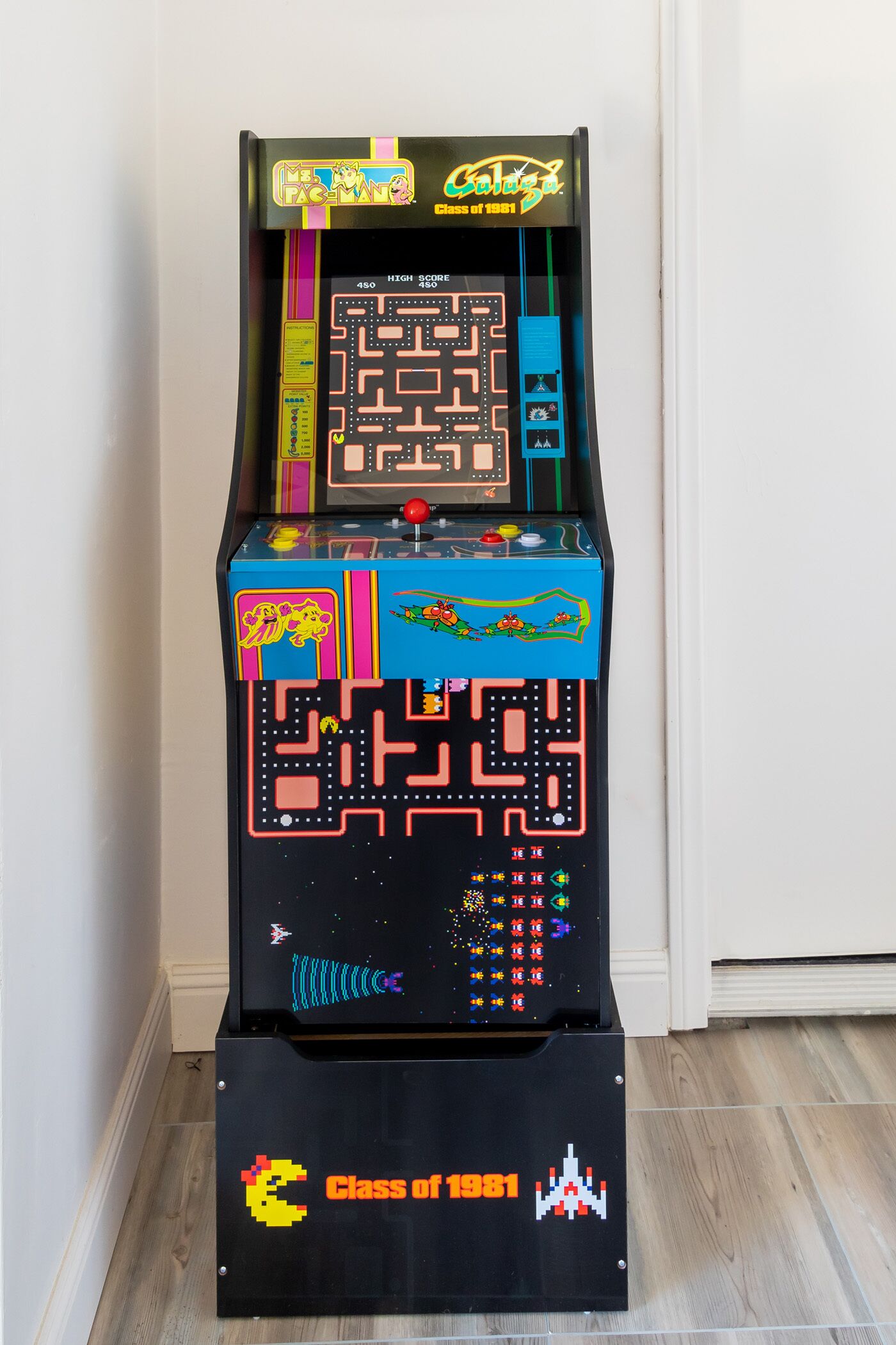 A retro arcade machine with a maze game, labeled "Class of 1981."