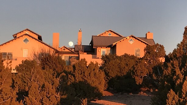 A large house with multiple chimneys, surrounded by dense trees. - sweet little casita (Santa Fe)