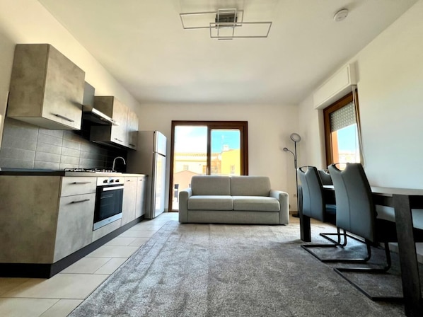 Premier Apartment | Living area | 55-inch Smart TV with digital channels, TV, streaming services
