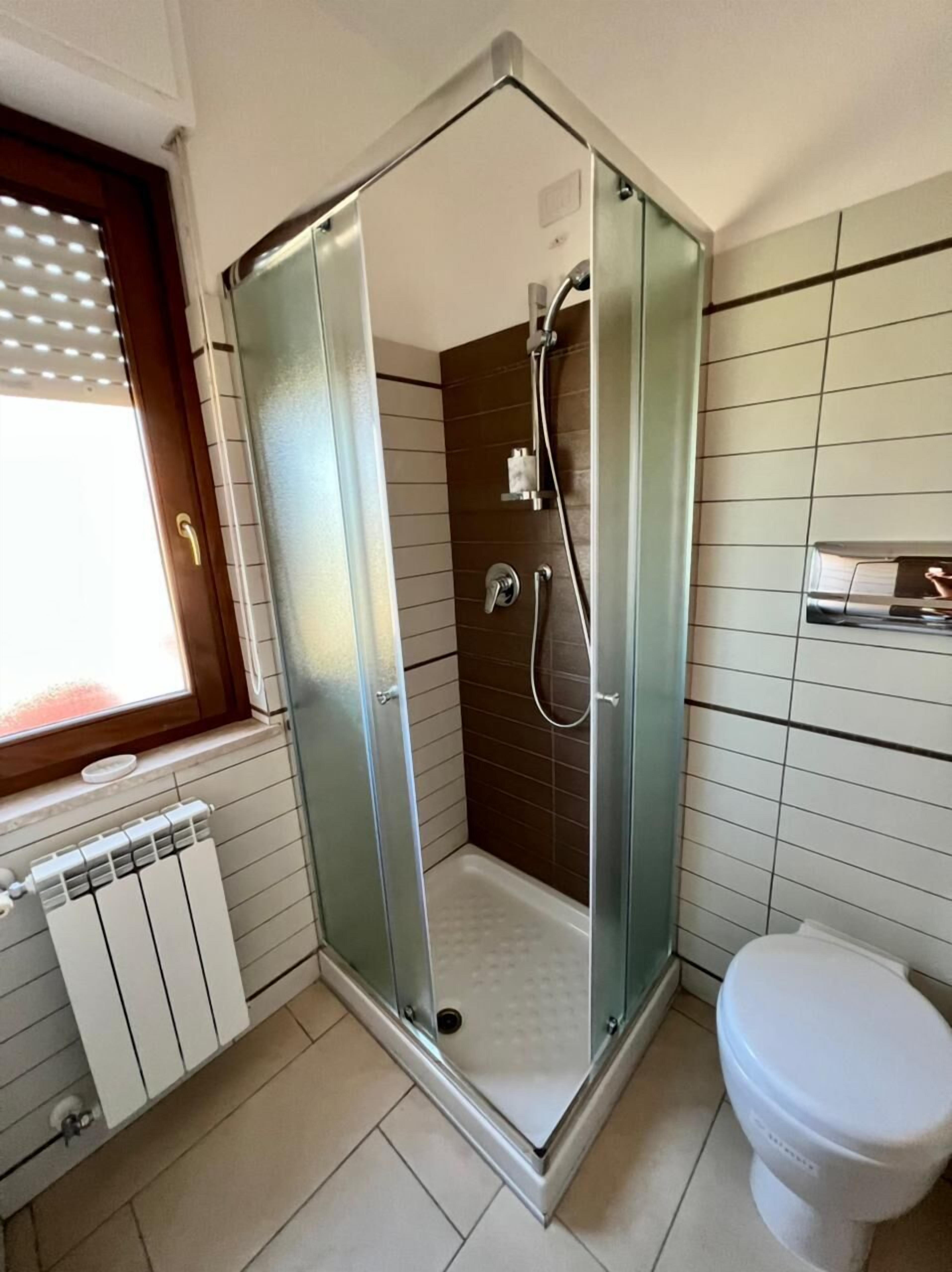 premier apartment | bathroom | hair dryer, bidet, heated floors, towels