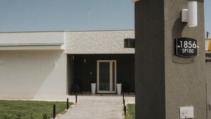 A building with a stone facade, a door, and a sign reading "1856 SP100". - Harmony B&B (Leporano)