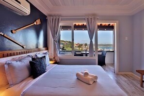 Deluxe kamer, 1 queensize bed, uitzicht op zee | Een minibar, een kluis op de kamer, gratis wifi, beddengoed