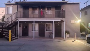 Stunning two-story building with a balcony and charming entrance.
