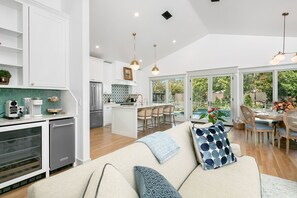 Enjoy a spacious open-plan living area with a kitchen, dining space, and comfortable seating.