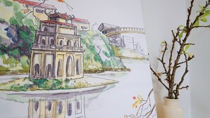 A watercolor painting of a traditional building with a bridge, surrounded by greenery and water. - Hanoi Old Quarter Center - 1BR Studio - Big window & Balcony & Private Bathroom (Hà Ni)