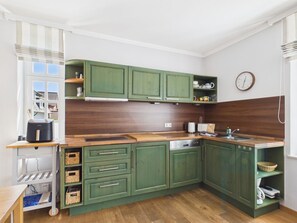 Fridge, stovetop, dishwasher, coffee/tea maker