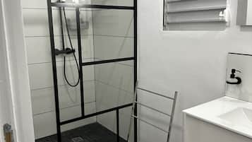 Shower, towels, soap, toilet paper