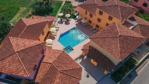 An aerial view of a property with a swimming pool, outdoor seating, and a tiled roof. - Cala Viola Trilo 1.5Km From The Beach, Orosei, Italy (Orosei)