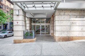 Welcome to 1501, where sleek lines and lush greenery greet you at the entrance.