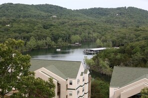 Escape to a serene lakeside retreat with a modern building offering tranquil accommodations and access to water activities.