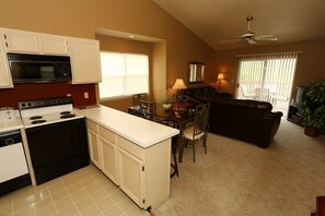 Cozy living space with a kitchenette, dining area, and comfortable seating.