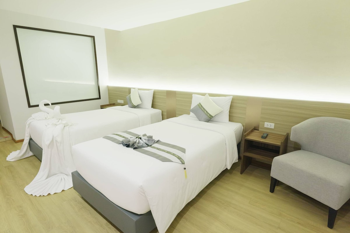 Deluxe Room, 2 Twin Beds | Cortinas opacas, sistema de insonorización, wifi gratis y ropa de cama