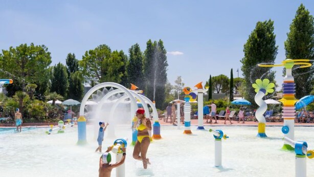 A water park with various play structures and a pool area. - Garda Family Plus by Interhome (Desenzano)