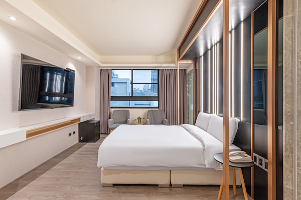 Habitación doble Deluxe | Cortinas blackout, insonorización, wifi gratis y ropa de cama