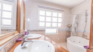 A bathroom with two sinks, a bathtub, and a shower. - Nice 3 Bedroom Villa in El Duque  (Costa Adeje)