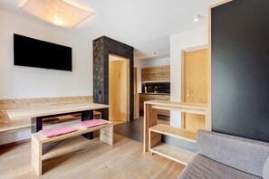 A modern kitchen with wooden cabinetry and a built-in oven.