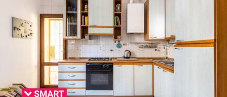 Fridge, oven, electric kettle, cookware/dishes/utensils