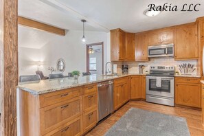 Fridge, coffee/tea maker, cookware/dishes/utensils