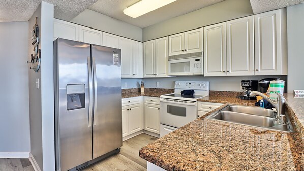 Fridge, microwave, oven, stovetop - 401 North Tower - Barefoot Resort Rentals (North Myrtle Beach)