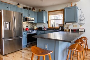 Toaster, cookware/dishes/utensils, dining tables