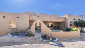 A desert-style building with a courtyard, a covered patio, and a small garden area. - Western desert escape, pool, backyard oasis (Phoenix)
