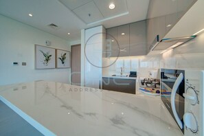 Fridge, microwave, stovetop, coffee/tea maker