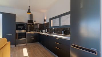 Luxury Villa | Private kitchen | Full-size fridge, microwave, oven, stovetop