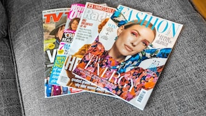 A magazine spread on a textured fabric surface. - Brand New Apartment - Parking - Stourbridge (Stourbridge)