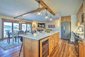 Enjoy cooking in this well-lit kitchen with a large island, ample counter space, and an oven.