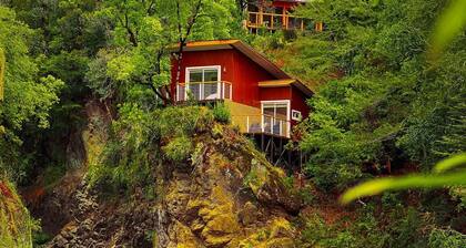 Cabin in the mountains on the banks of the river