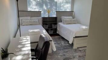 2 bedrooms, desk, iron/ironing board, travel crib