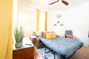 1 bedroom, desk, iron/ironing board, travel crib