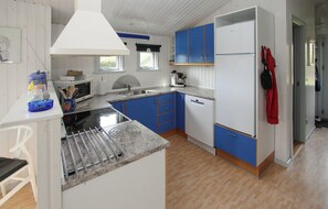 Fridge, stovetop, dishwasher, coffee/tea maker