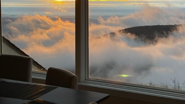 A room with a large window offering a view of clouds and a distant landscape. - Sauna, dog friendly Amazing views to ski slopes (Wintergreen Resort)