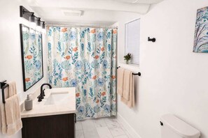 Regadera y secadora de cabello 