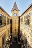 A building with a clock tower and the name "EAST STAR HOTEL" on the facade.