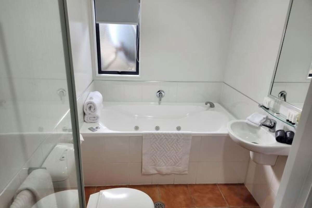 Bathroom | Shower, rainfall showerhead, hair dryer, bathrobes