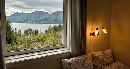 Holiday home with view plot beyond Fjord and mountains.