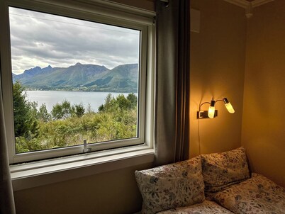 Holiday home with view plot beyond Fjord and mountains.