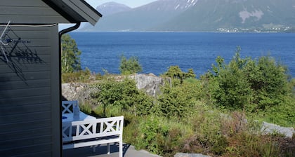 Holiday home with view plot beyond Fjord and mountains.