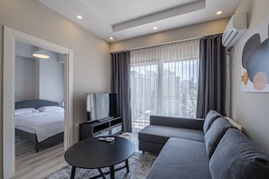 Basic Apartment | Living area | 50-inch Smart TV with digital channels, TV, Netflix