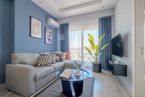 Basic Apartment | Living area | 50-inch Smart TV with digital channels, TV, Netflix