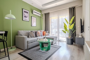 Basic Apartment | Living area | 50-inch Smart TV with digital channels, TV, Netflix